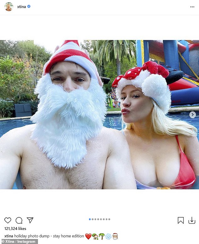 Sexy Santa: Christina Aguilera introduced the sexy Mrs. Claus in a busty red bikini, as she ordered some fake Christmas snowflakes by the pool with her fiancé Matthew Rutler and their kids, and posted a glimpse Monday on Instagram