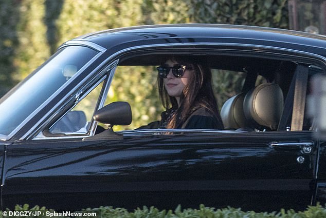 Solo driving: Melanie Griffith and Don Johnson's daughter wore a dark jacket and oversized sunglasses, with her tan locks dropping around her shoulders