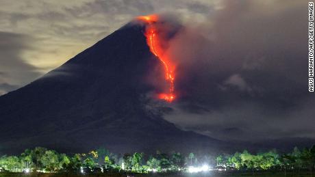 In this photo taken on January 16, 2021, lava is seen during an eruption of Mount Semeru volcano in Lumagang, East Java. 